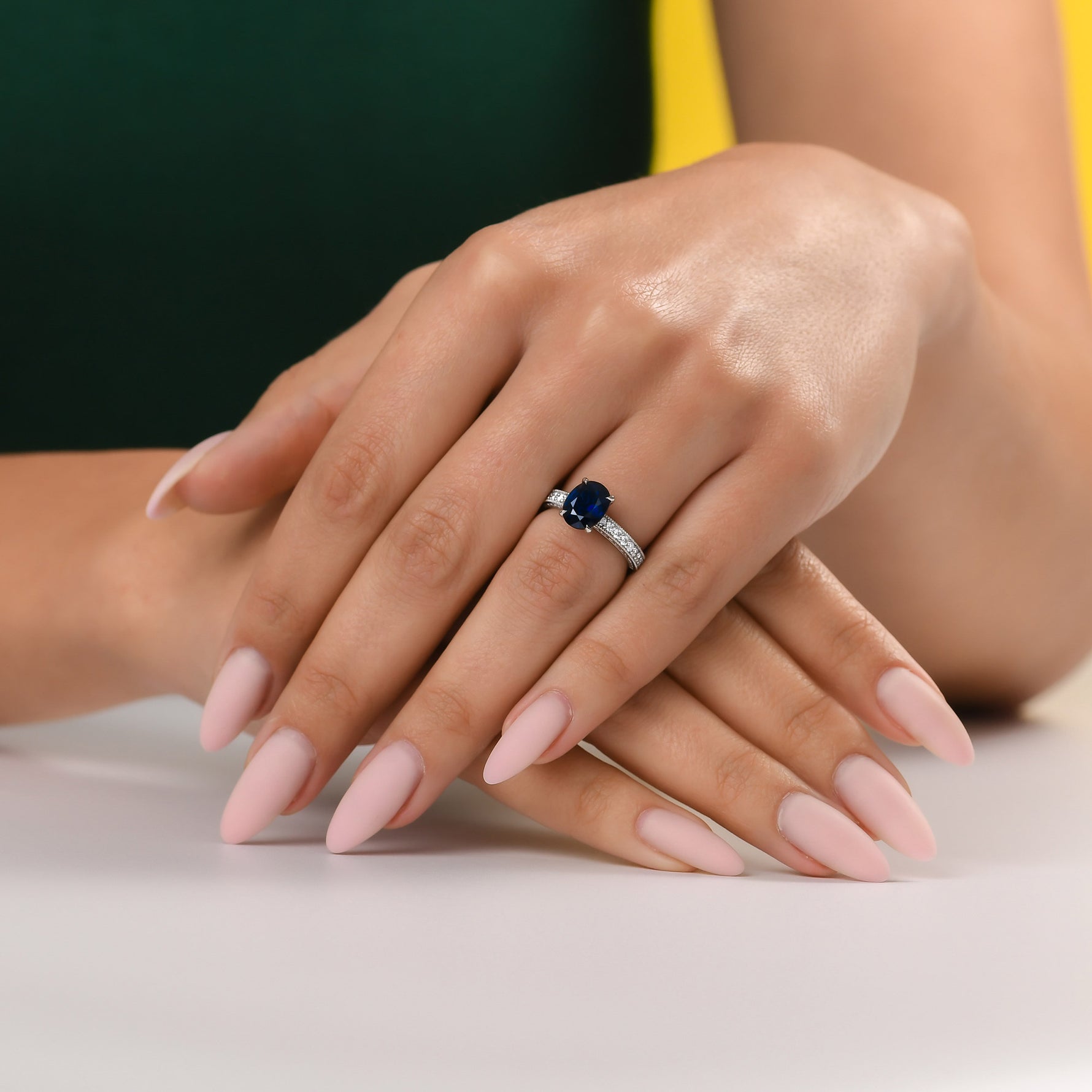 Oval Sapphire Solitaire Side Stone Ring