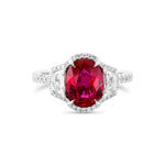 Oval Ruby Three-stone Halo Ring