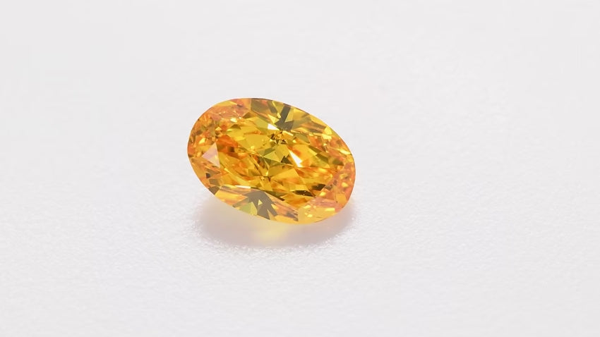 0.70 Carat Fancy Vivid Orange Yellow Oval Diamond SI1 GIA | LEIBISH