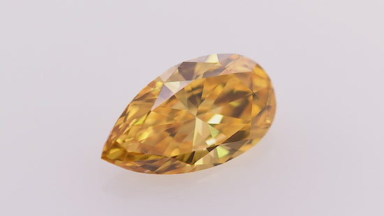 0.69 Carat Fancy Vivid Yellow Orange Pear Diamond SI2 GIA