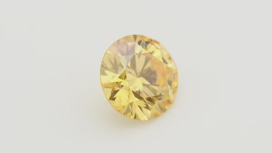 0.20 Carat Fancy Intense Yellow Orange Round Diamond SI2 GIA