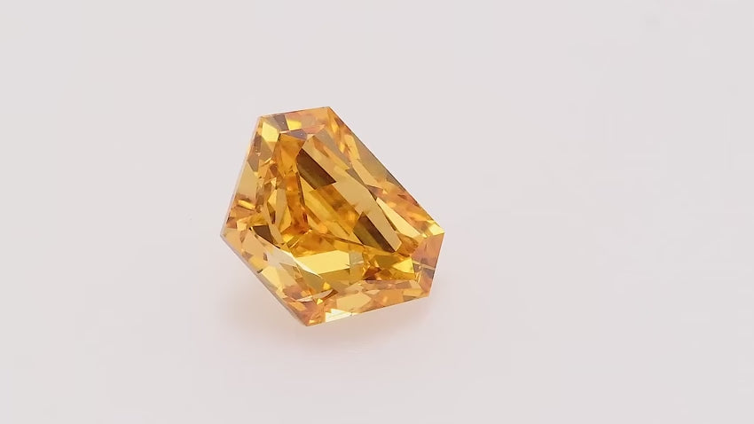 0.57 Carat Fancy Vivid Yellow Orange Trapezoid Diamond SI2 GIA