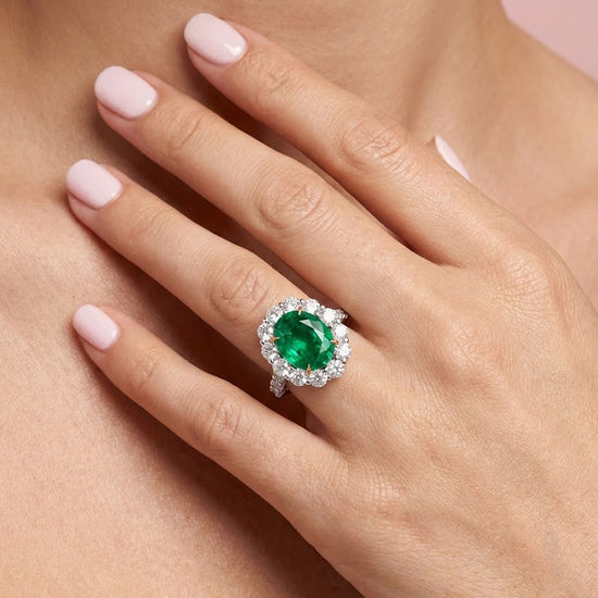 Oval Muzo Emerald and Diamond Halo Ring
